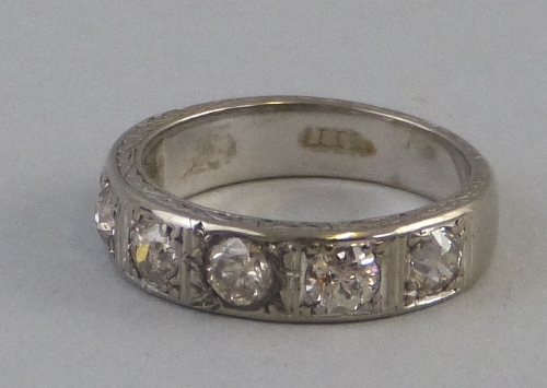 A diamond eternity ring, half hoop comprising an 18ct white gold shank set with six diamonds (