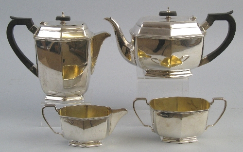 A four piece tea and coffee set, the teapot of hexagonal form with ebonised finial on flattened