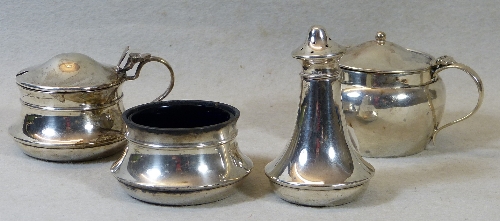 A three piece condiment set, the circular mustard pot with domed hinged lid, scroll loop handle