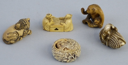 Four Japanese ivory netsukes, two figures seated playing checkers, 4.5cm long, rat climbing coil