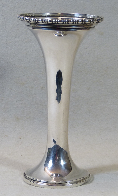 A trumpet vase, having beaded stepped rim and stepped circular spreading base, 15cm high, Birmingham