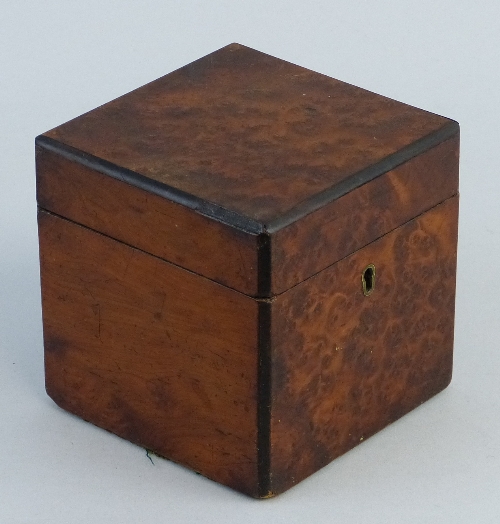 A 19th Century yew wood tea caddy, of cuboid form with burr wood top and front, the hinged lid