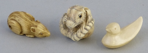 Three Japanese ivory netsukes, reclining rat, 4.5cm wide, duck, 4.5cm long and coiled rat, 3.5cm