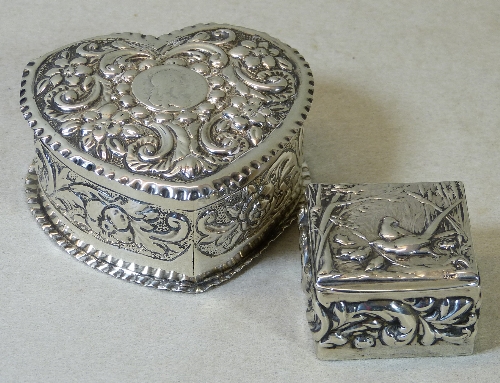 A Victorian trinket box, of heart shape embossed all over with scrolling foliage and flowerheads,