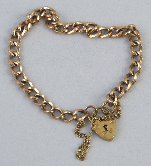 A 9ct gold bracelet, in square section curb links with padlock clasp, 18.5cm long, 12.3 grams