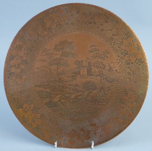 A copper plaque, of circular form chased with the Spode tower pattern, unframed, 27.5cm diameter