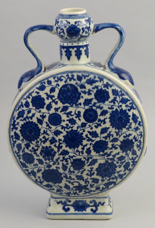 A Chinese moon flask, of two handled form with bulbous neck, printed all over in blue and white with