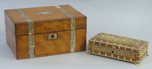 A 19th Century Indian sandalwood box, of oblong form with all over bone onlay of pierced panels,