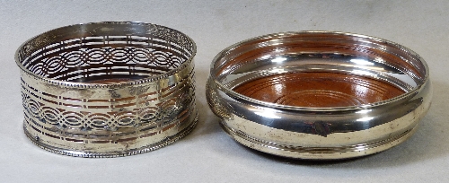 A bottle coaster, of circular bulbous form with line incised mahogany base, 14cm wide, Birmingham