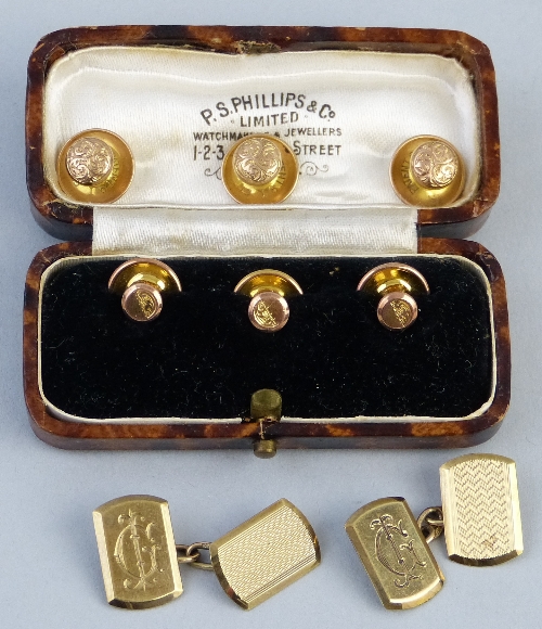 A pair of 9ct gold cuff links, having rounded oblong panels, monogrammed JG (GJ) and with engine