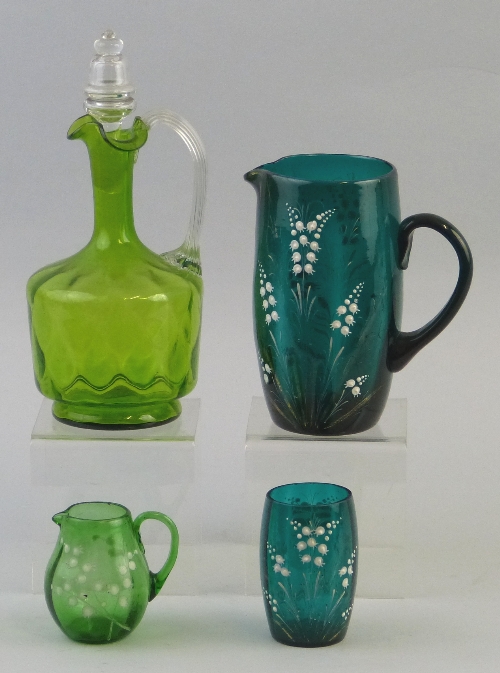 A Victorian turquoise glass jug, of barrel shaped form with scrolling handle, enamelled and gilded