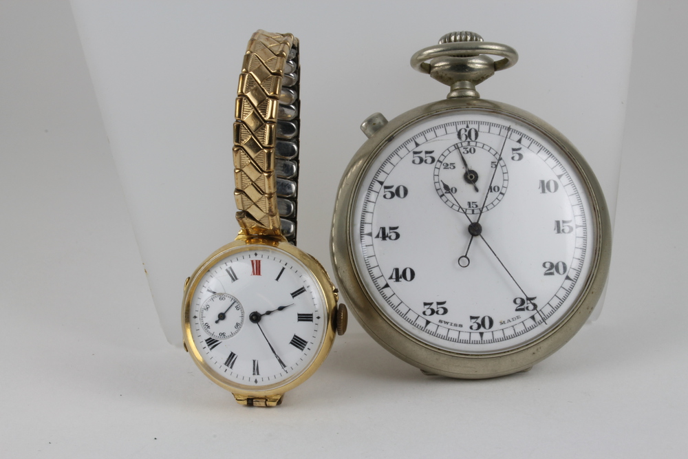 A lady`s 18ct gold cased wristwatch with seconds at 9 o`clock and a Military issue silver plated