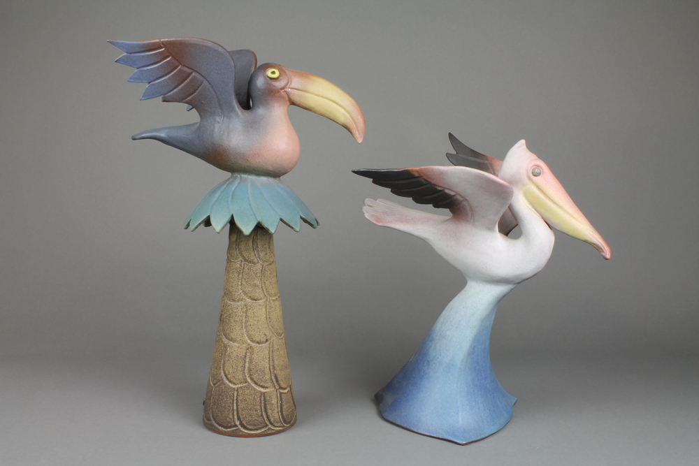 Tessa Fuchs, a polychrome glazed figure of a heron 12"", a ditto of an exotic bird sitting on a