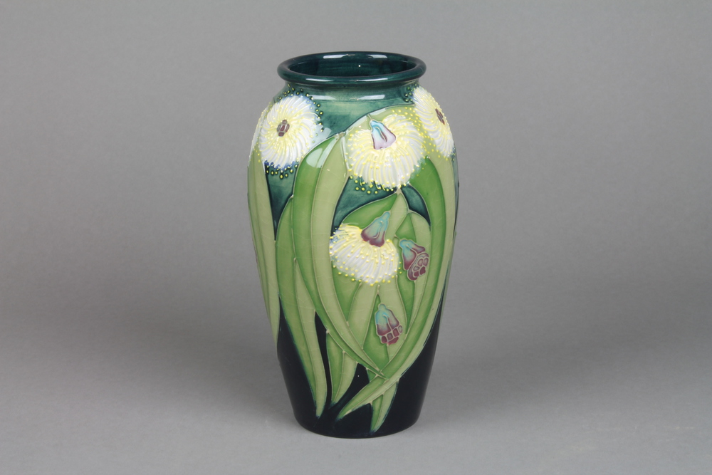 A late 20th Century Moorcroft oviform vase, green ground with stylised flowers, printed marks 7.