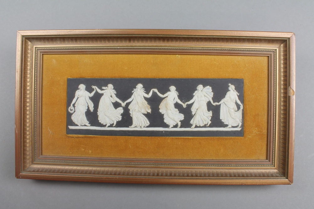 A Wedgwood black Jasper panel of classical figures, framed and mounted 13