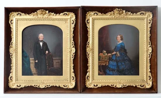 A pair of hand coloured Victorian photographs of figures within an interior , both in exquisite gilt