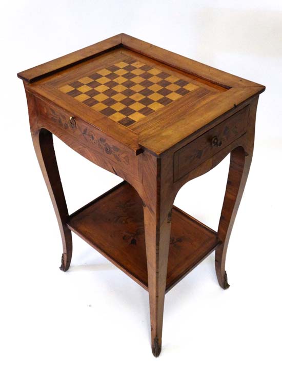 A c.1900 Continental inlaid Kingwood games table with reversible top having a checkerboard to one