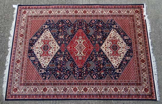 Rug carpet : A machine-made rug in the style of a Persian rug. 92 x 62”.   CONDITION:  Please Note -