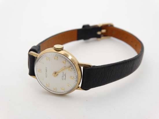 A 9ct Gold ladies wrist watch by ' Rotary ' with 17 Jewel and cal '34' movement with gilt hands