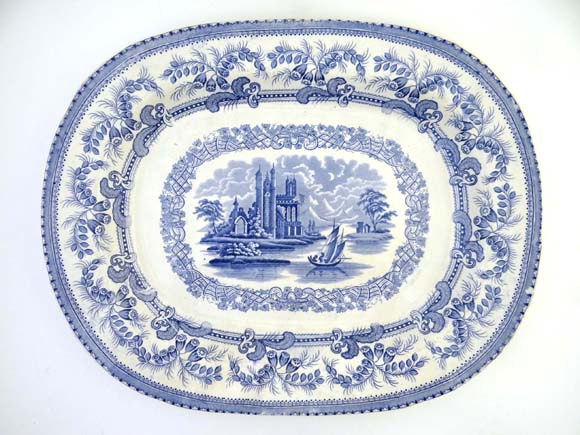 A c1845 blue and white transfer printed large meat plate decorated in Gem pattern depicting exotic