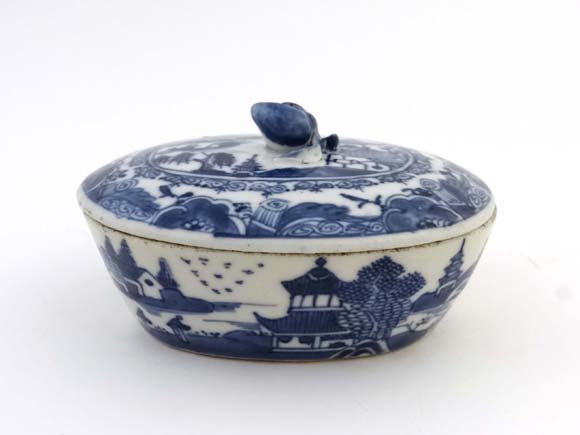 18/ 19 thC Chinese ceramic : A blue and White Chinese lidded oval pot and cover with Apricot Finial.