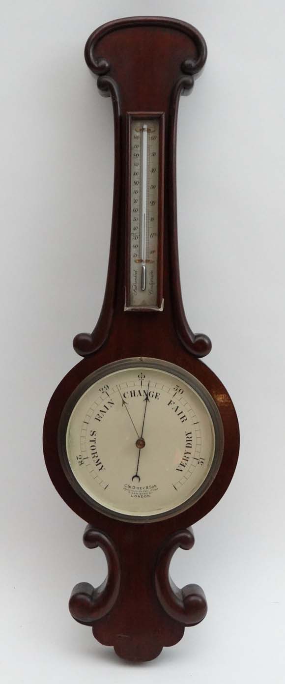 A  C W Dixey & Son Opticians to the King 3 New Bond St London : A wheel barometer surmounted by a