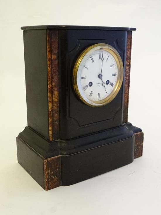 A Marble and slate cased Mantle Clock : an 8 Day Vincent & Cie movement striking on a bell , trimmed