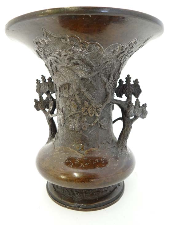 Late 19thC Japanese bronze vase with short wide body and flaring neck. The body is decorated front