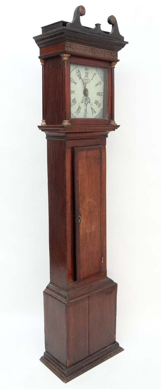 Longcase : a mahogany cross banded oak cased longcase clock having an 11" painted dial signed ' B.
