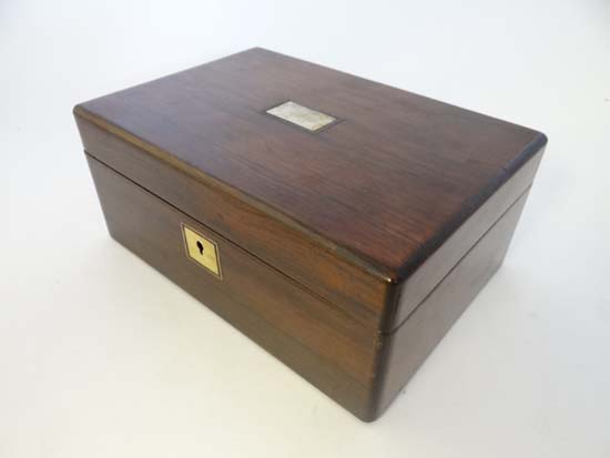 A 19thC Rosewood workbox with mother of pearl escutcheon and inlay to top and opening to reveal lift
