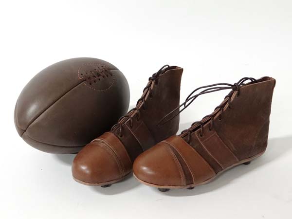 Rugby : An vintage leather Rugby ball and leather rugby boots, the ball 11 3/3" long

Please
