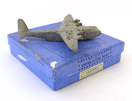 A Dinky Toy C1936 Empire flying boat-No 60R `Caledonia` boxed with gliding. Please Note-