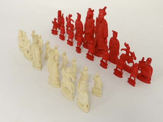 Chess : A 1920`s carved Cantonese ivory set of 30 chess pieces, the tallest 3 3/4" in red and