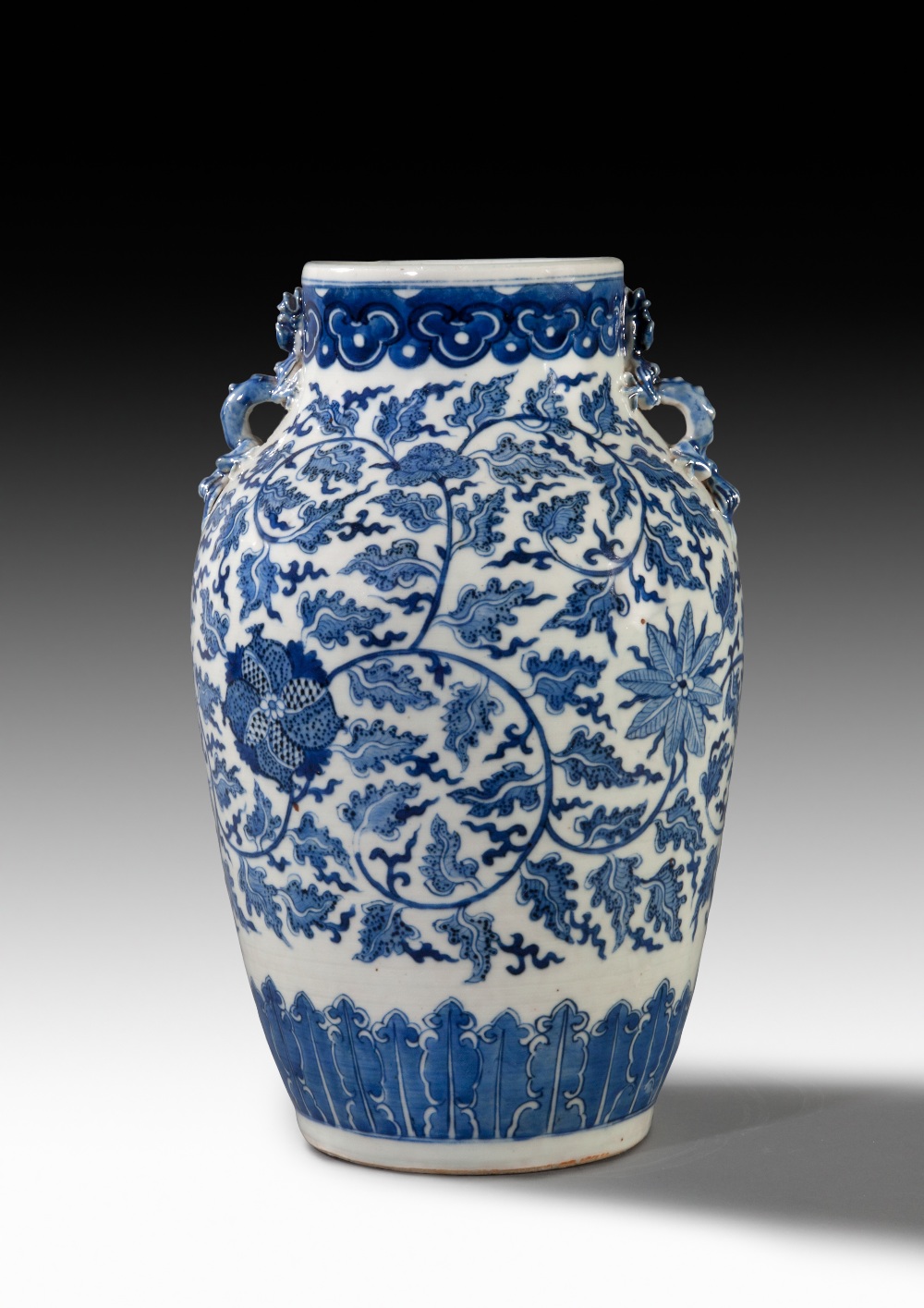 A LARGE BLUE-AND-WHITE BALUSTER FLORAL JAR, 18TH CENTURY, H: 31 cm.
The vase is moulded with band of