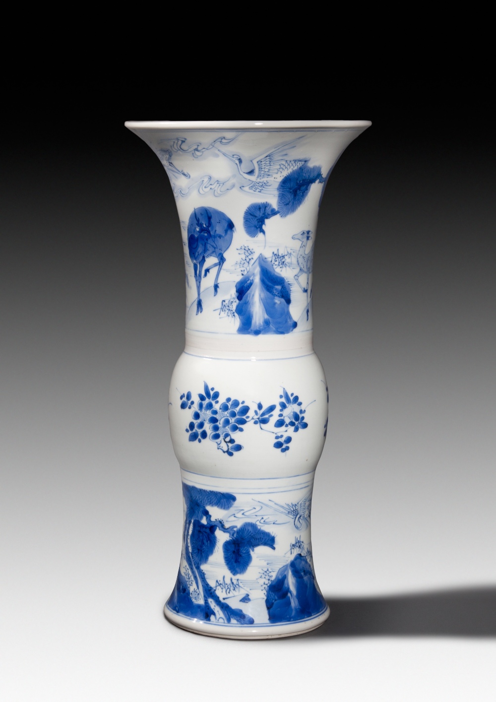 A BLUE-AND-WHITE  BEAKER VASE, KANGXI PERIOD, H: 44.5 cm.
Provenance: British private