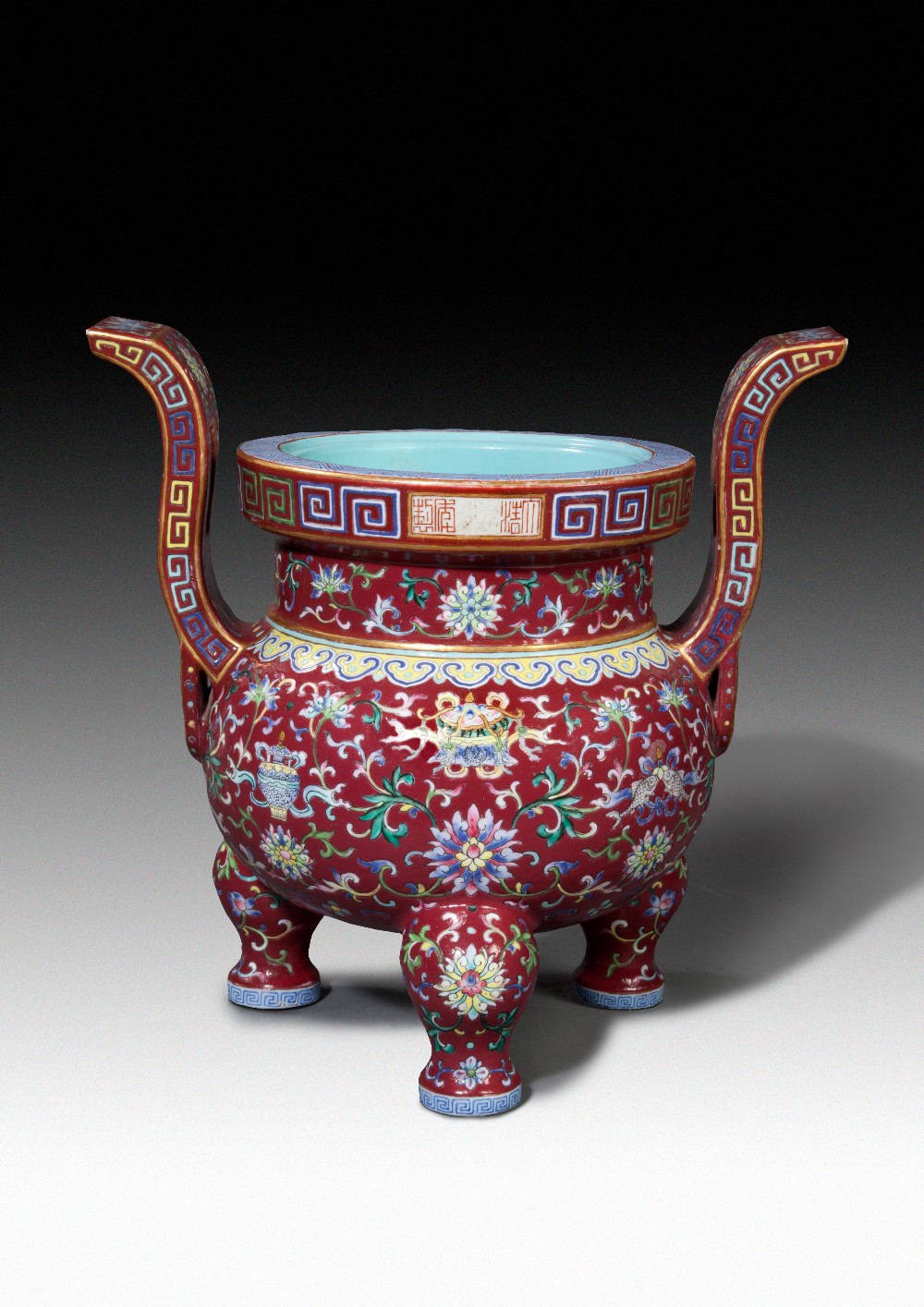 A CHINESE FAMILLE ROSE RUBY GROUND TRIPOD INCENSE BURNER, JIAQING MARK AND PERIOD (1796-1820), H: