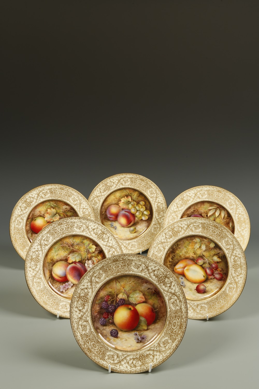 A SET OF SIX ROYAL WORCESTER PLATES, each painted to the centre with different fruit scenes,