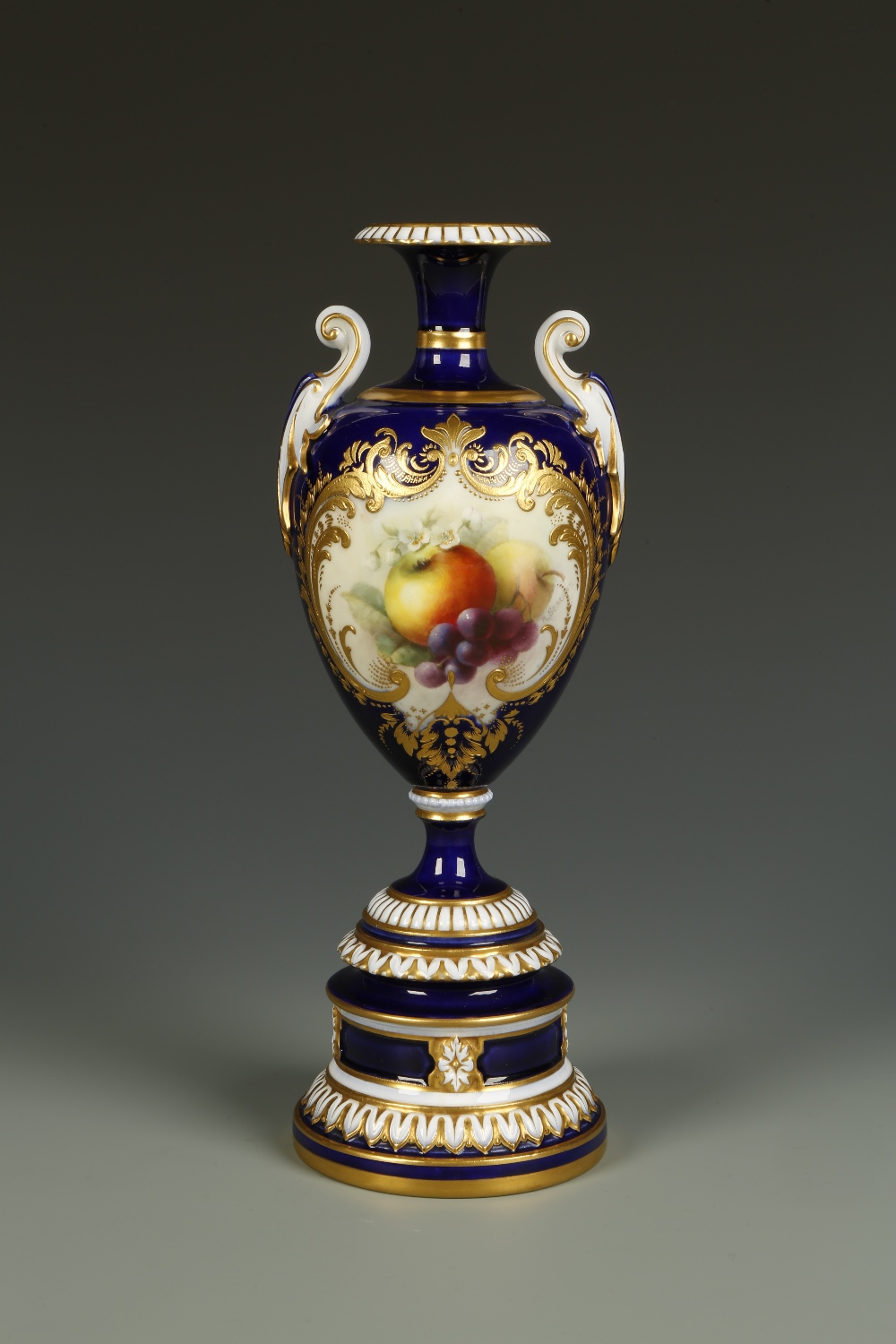 A ROYAL WORCESTER VASE of urn form, painted with fruit and blossom, by Richard Sebright, signed R.