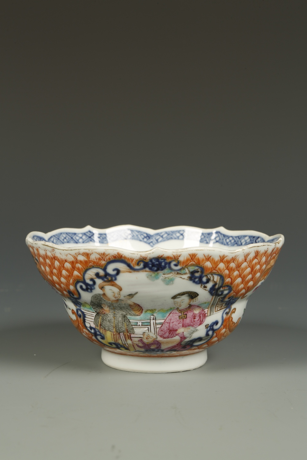 A FINE CHINESE FAMILLE ROSE OGEE BOWL, the exterior decorated with panels showing a lady smoking,
