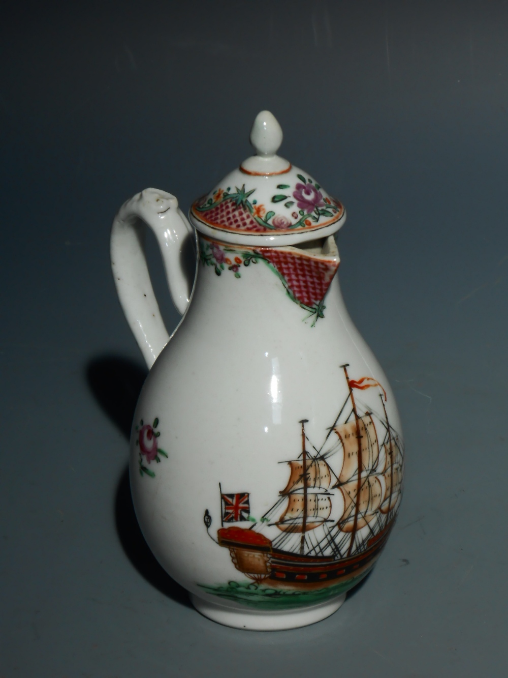 A CHINESE FAMILLE ROSE JUG (and later cover), the body decorated with a British man o`war ship,