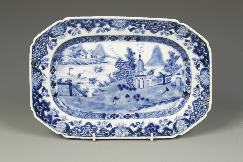 A CHINESE EXPORT BLUE AND WHITE OCTAGONAL SERVING DISH decorated with monks outside a western