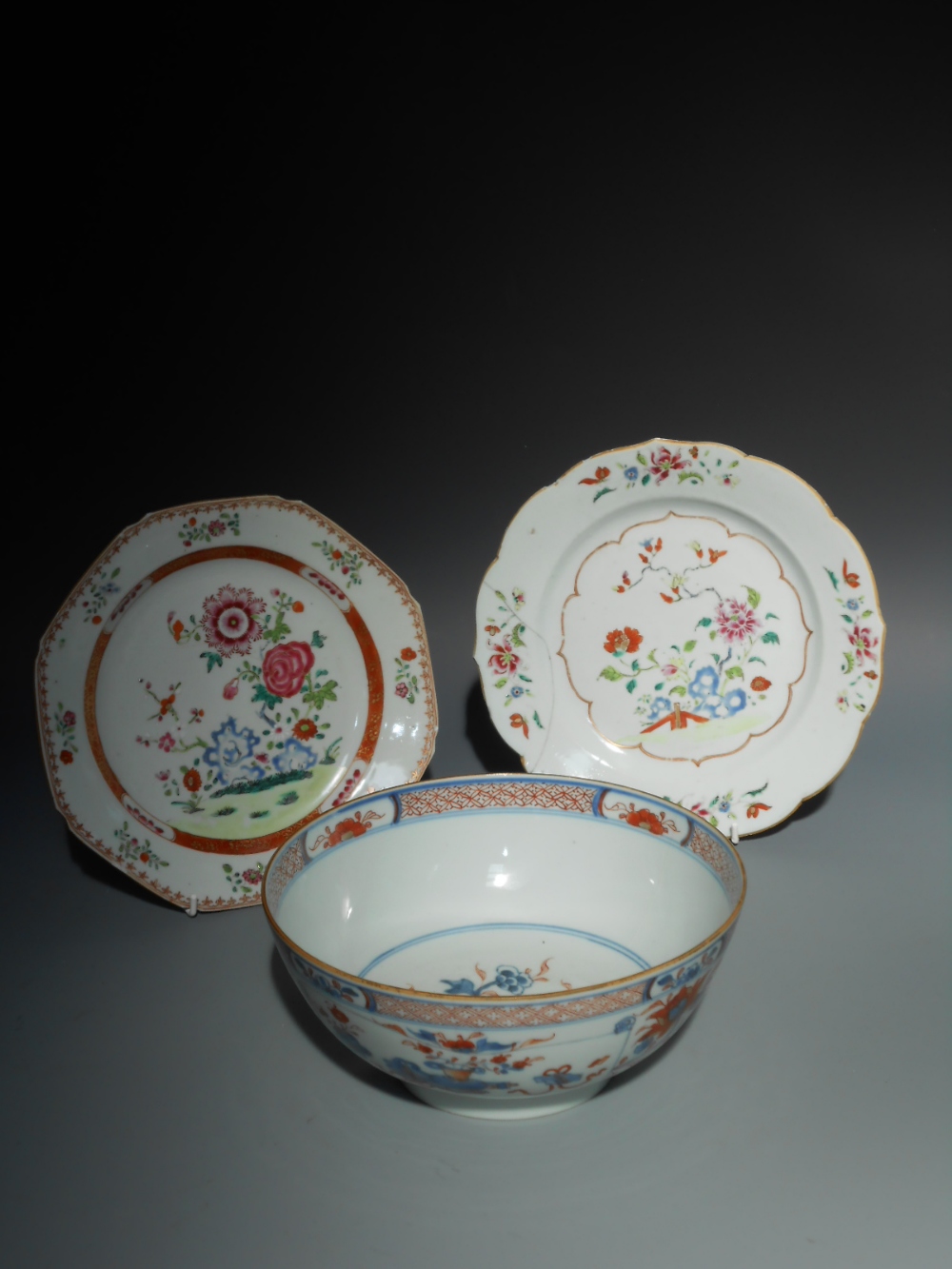 TWO CHINESE FAMILLE ROSE PLATES, Qing, 9"" dia.; and a Chinese Imari bowl, Qing, 9"" dia. (3)