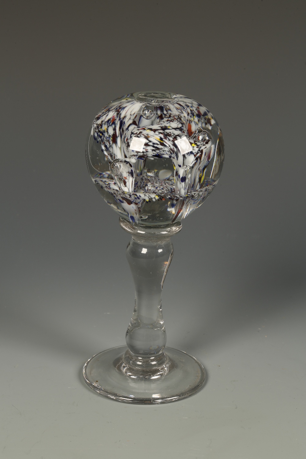 A PEDESTAL GLASS PAPERWEIGHT, the spherical top with internal multi-coloured and bubble decoration,