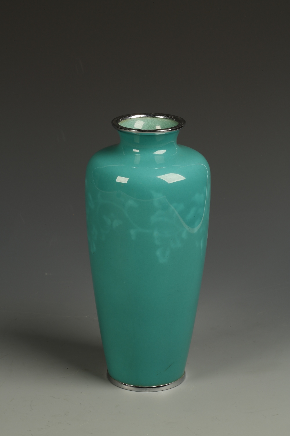 A JAPANESE `WIRELESS` CLOISONNE VASE of slender form, the fine green body with a lighter band of