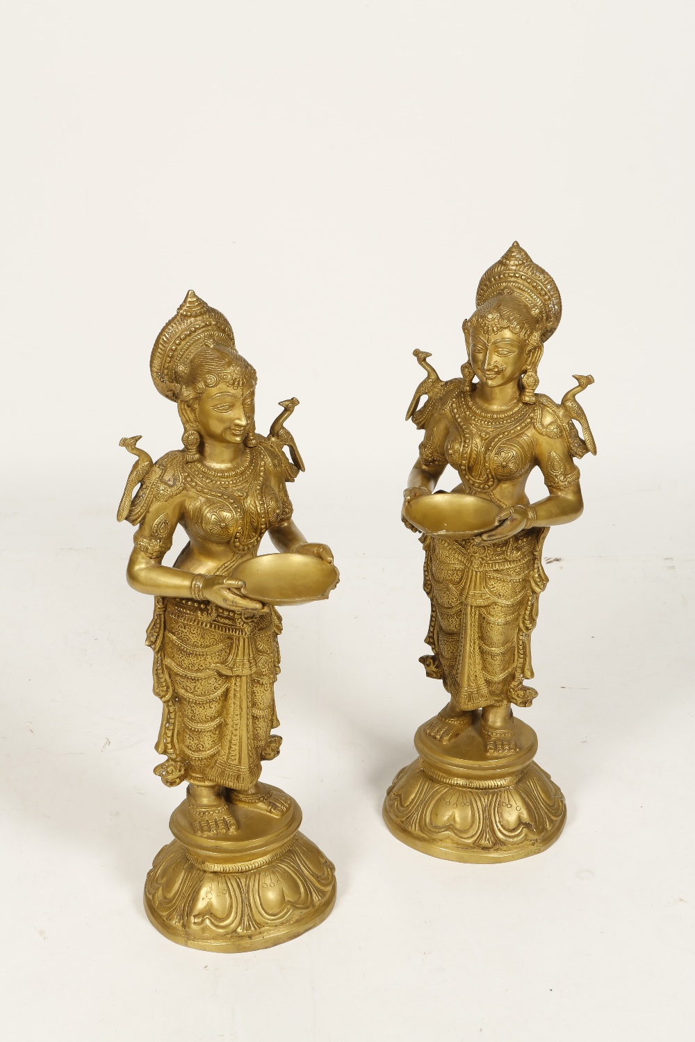 A PAIR OF LARGE INDIAN BRONZE/COPPER ALLOY FIGURES OF DIPA LAKSHMI, each holding an offering bowl