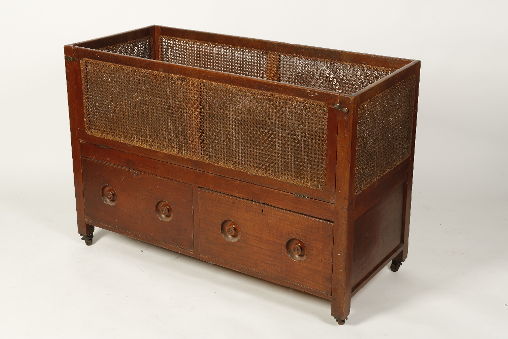 A VICTORIAN MAHOGANY FRAMED CHILDS "SHIPS" COT with double-caned sides and similar falling front