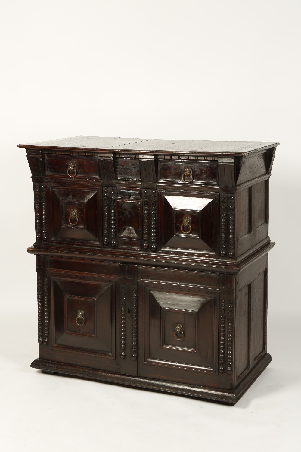 A LATE 17TH CENTURY OAK AND WALNUT ENCLOSED CHEST, the rectangular top above a long frieze drawer