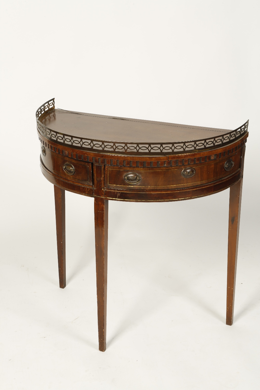 A 19TH CENTURY DUTCH MAHOGANY "D"-SHAPED SIDE TABLE with a pierced gilt metal frieze above two