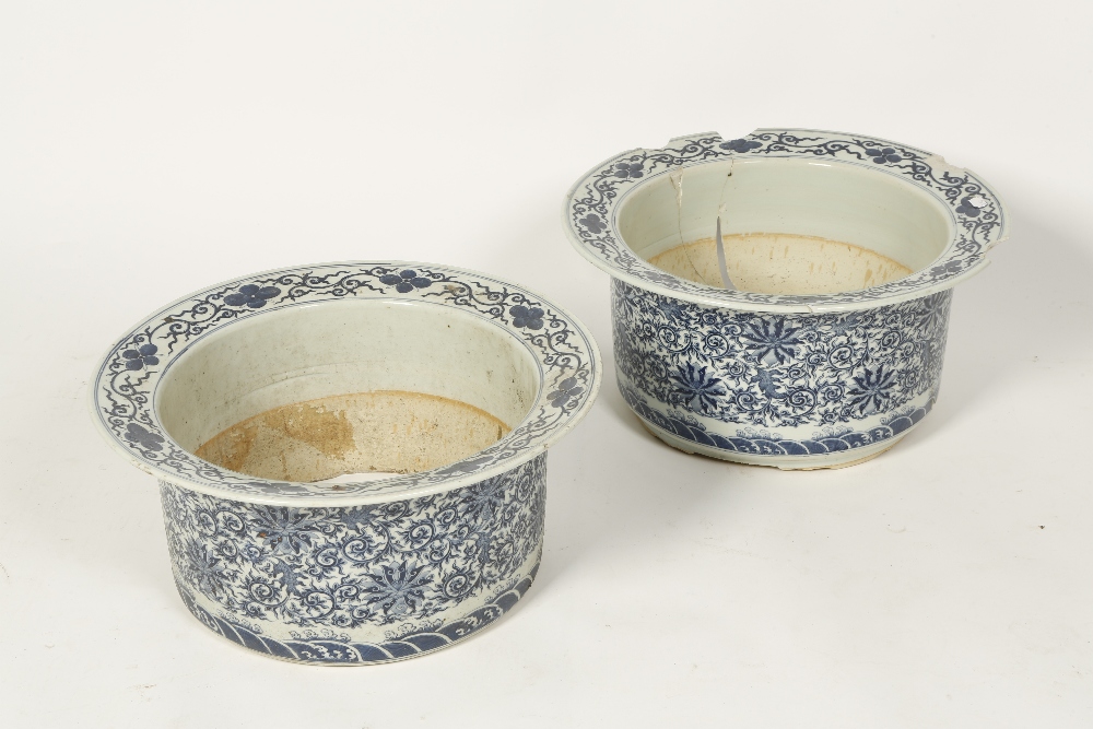 A PAIR OF CHINESE BLUE AND WHITE JARDINIERES of cylindrical form, with everted rims, decorated