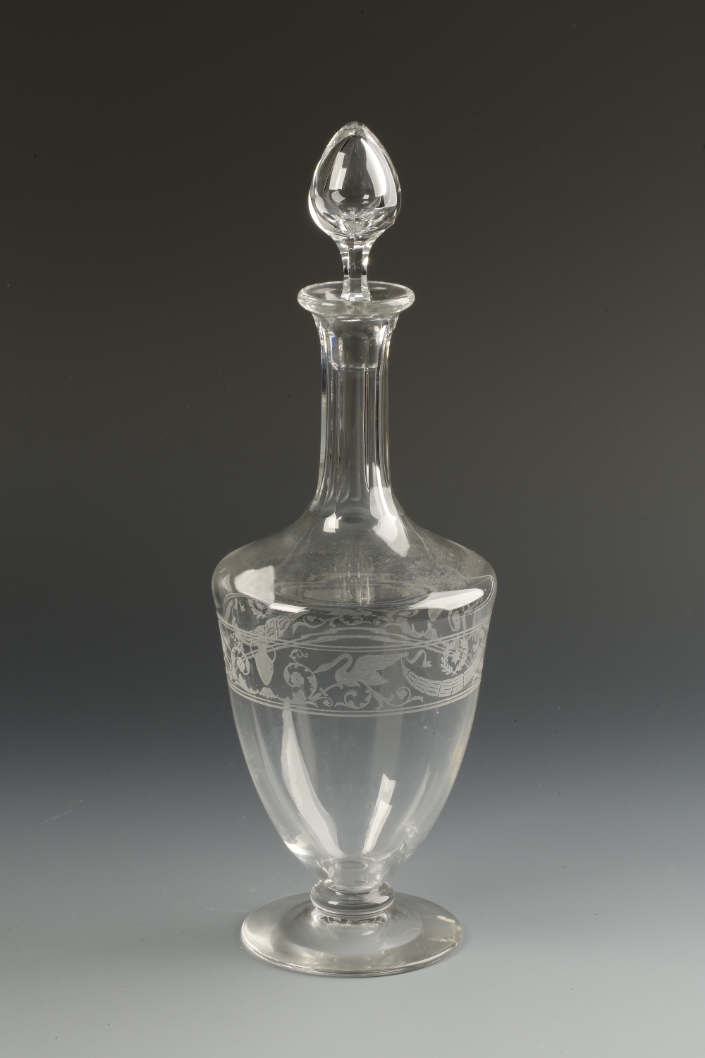 BACCARAT: A CLEAR GLASS GRECIAN REVIVAL DECANTER with a panel-cut neck and vase-shaped body with